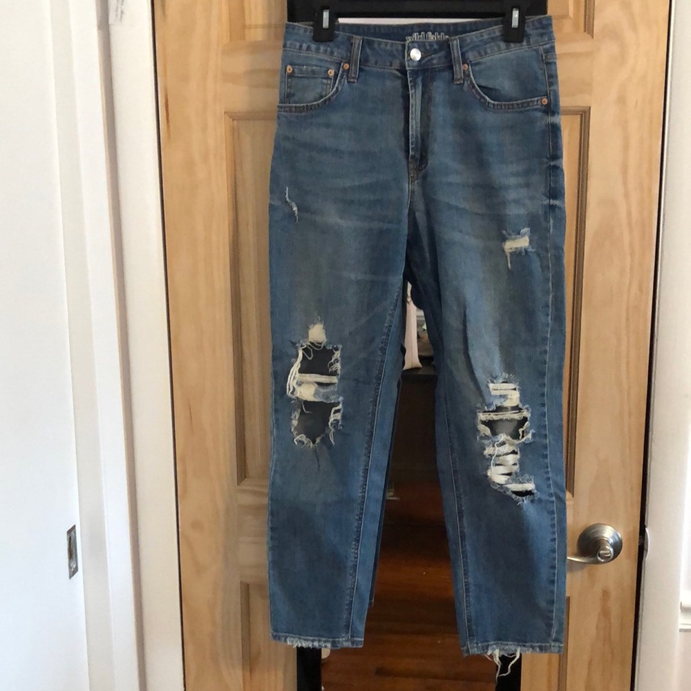 Light wash distressed blue jeans